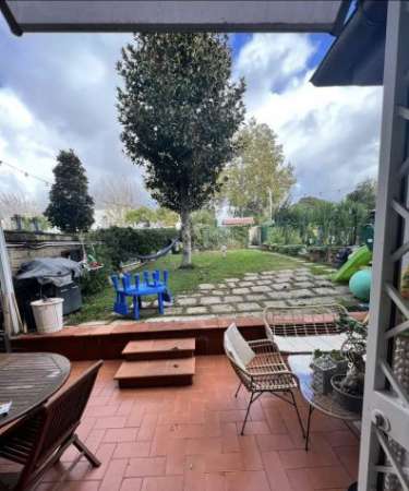 Foto AXA TRILOCALE CON GIARDINO E POSTO AUTO