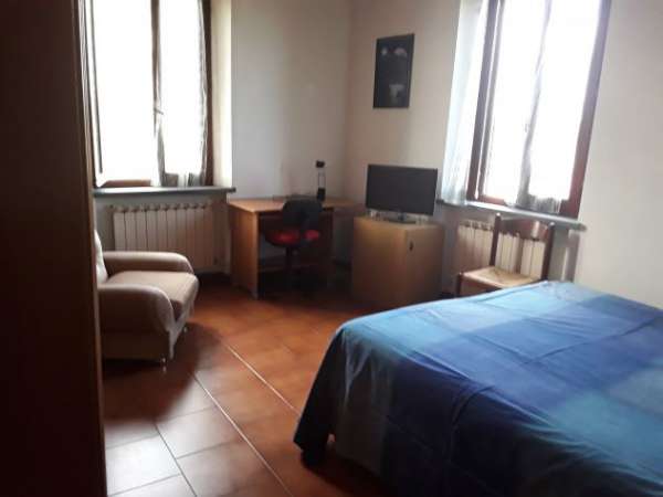 Foto Camera singola con bagno privato e posto auto