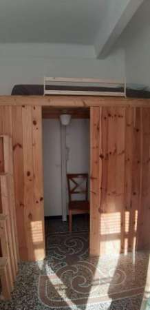 Foto Camera singola con soppalco