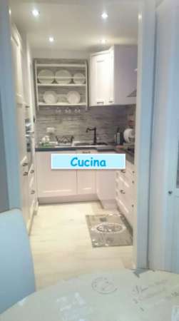 Foto CASAL PALOCCO/INFERNETTO TRILOCALE ARREDATO CON GIARDINO