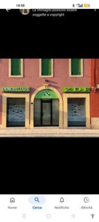 Foto NEGOZIO CON DUE AMPIE VETRINE