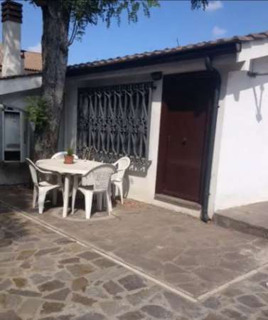 Foto POMEZIA BILOCALE CON GIARDINO E POSTO AUTO