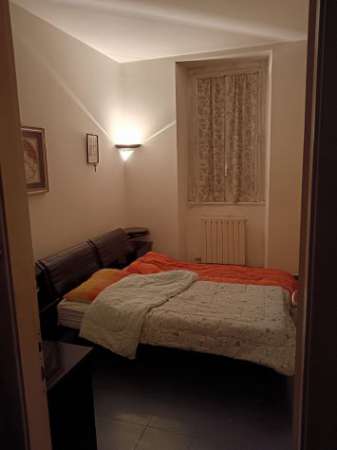 Foto Posto letto in camera matrimoniale